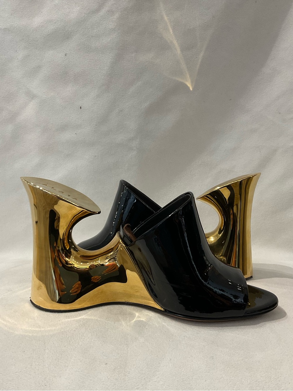 Alaïa La Sculpture Black Patent Leather Mules with Gold Sculptural Heels